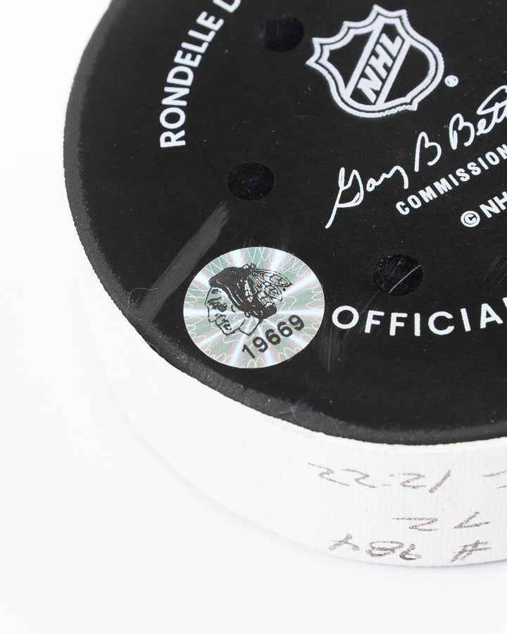 official game used hockey goal puck scored by Chicago Blackhawks player Teuvo Teravainen - hologram sticker detail lay flat