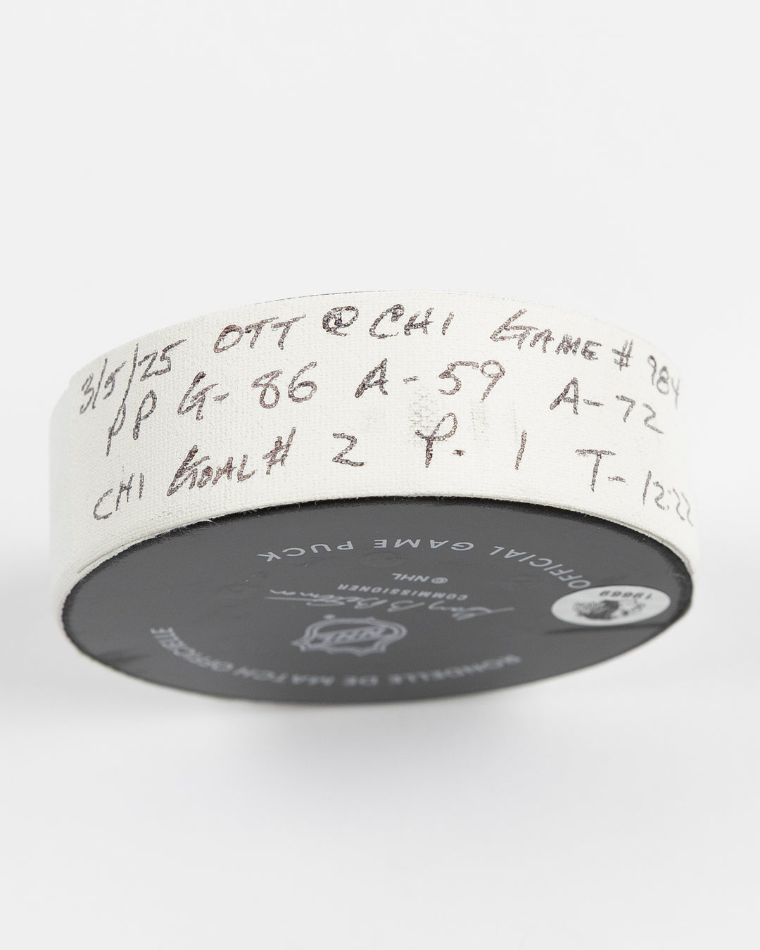 official game used hockey goal puck scored by Chicago Blackhawks player Teuvo Teravainen - tape detail lay flat
