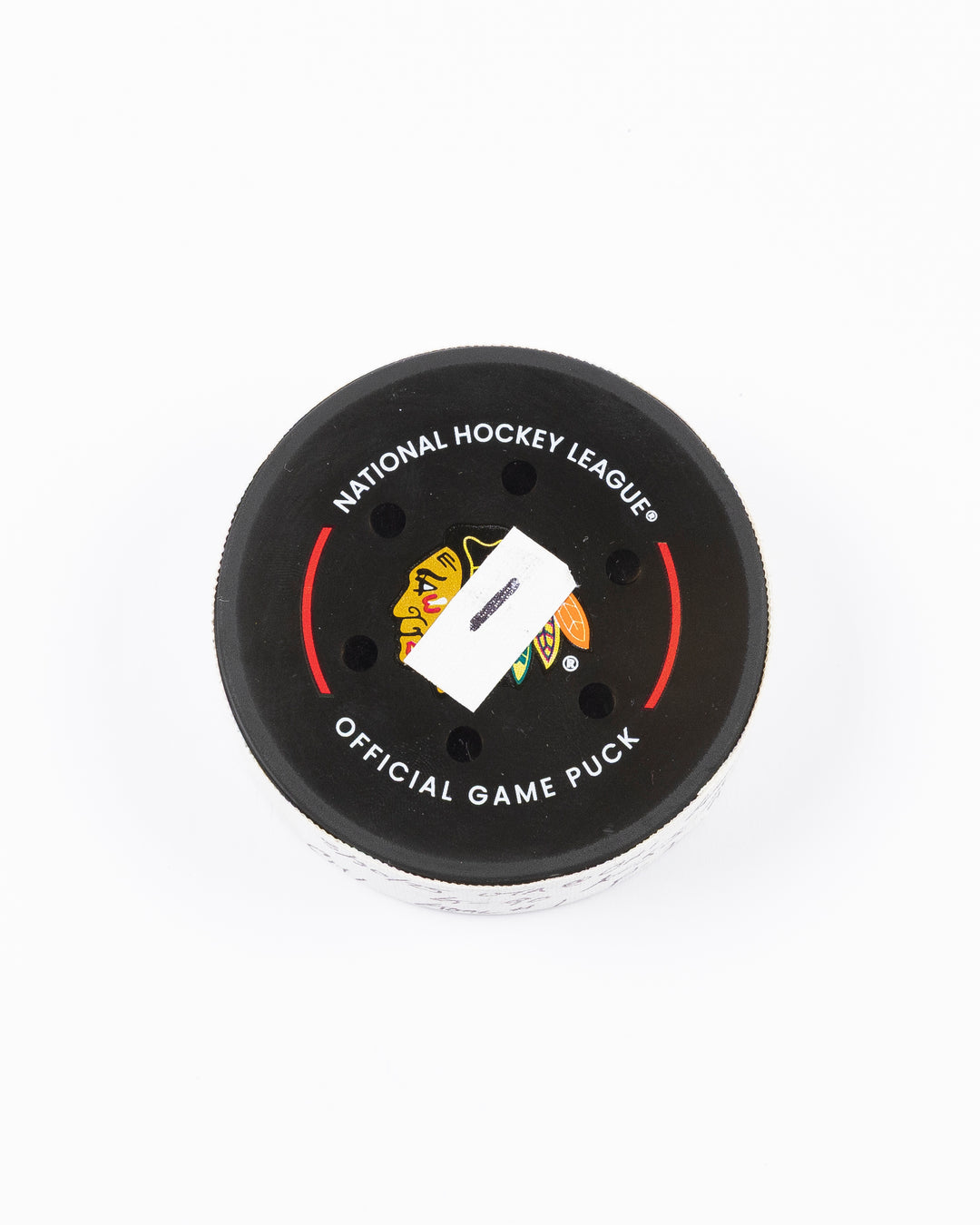 official hockey goal puck scored by Chicago Blackhawks player Joe Veleno on 3/28/25 - front lay flat