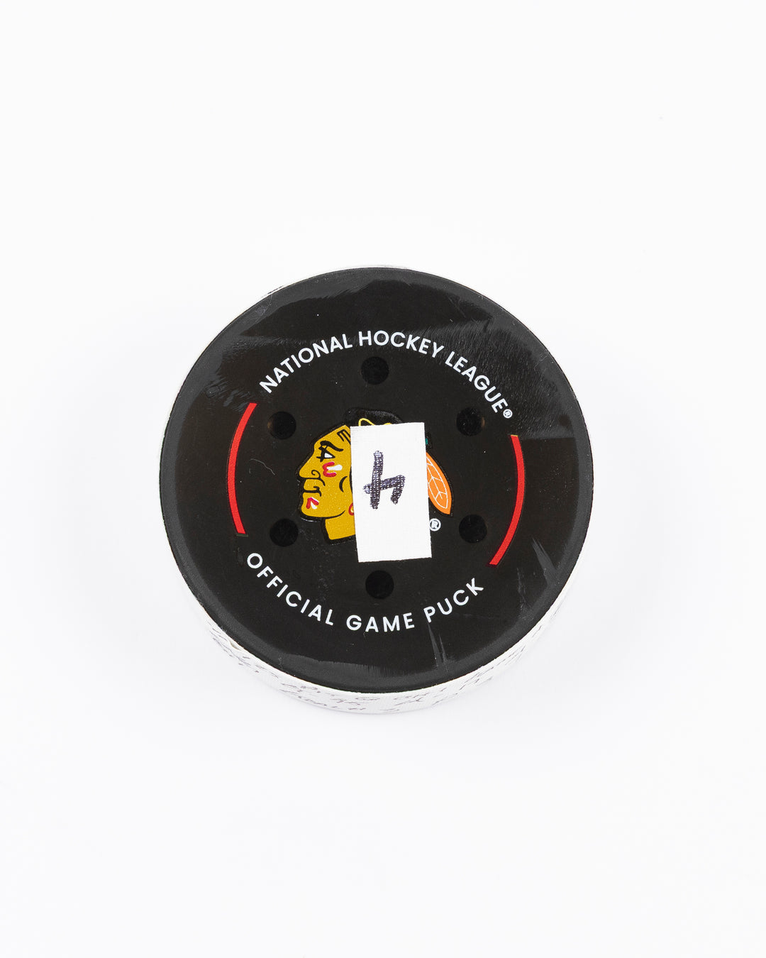 official hockey goal puck scored by Chicago Blackhawks player Ilya Mikheyev - front lay flat