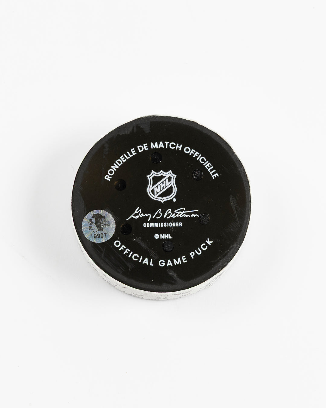 official hockey goal puck scored by Chicago Blackhawks player Ilya Mikheyev - back lay flat