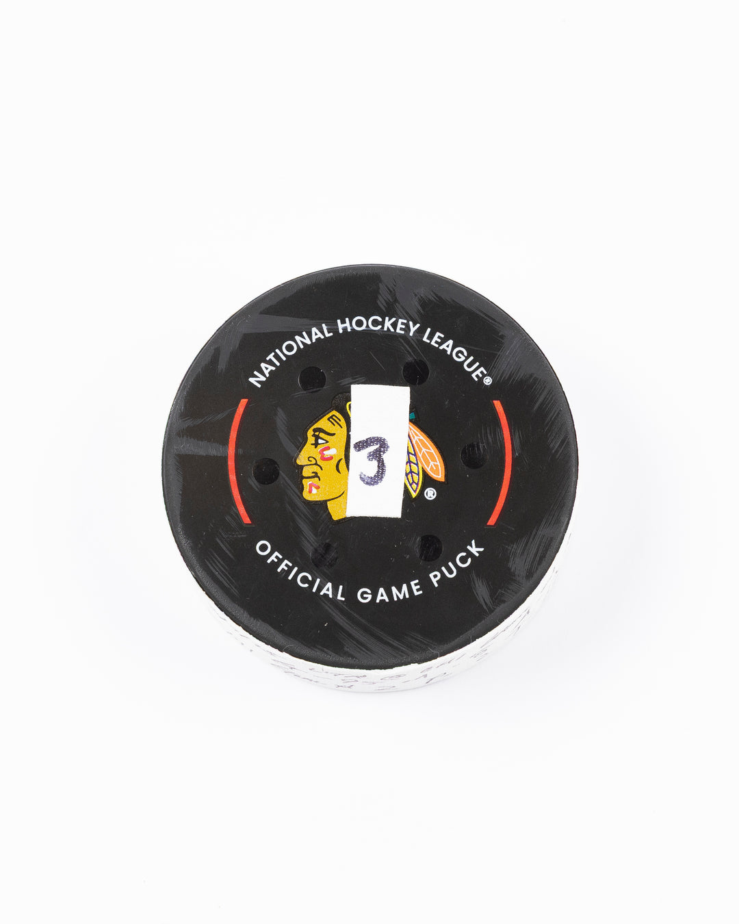 official game used hockey goal puck scored by Chicago Blackhawks player Ilya Mikheyev - front lay flat
