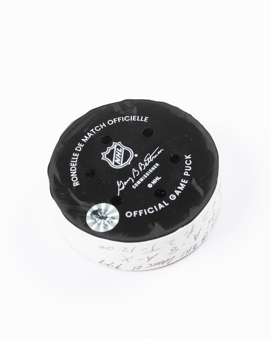 official game used hockey goal puck scored by Chicago Blackhawks player Ilya Mikheyev - back angle lay flat