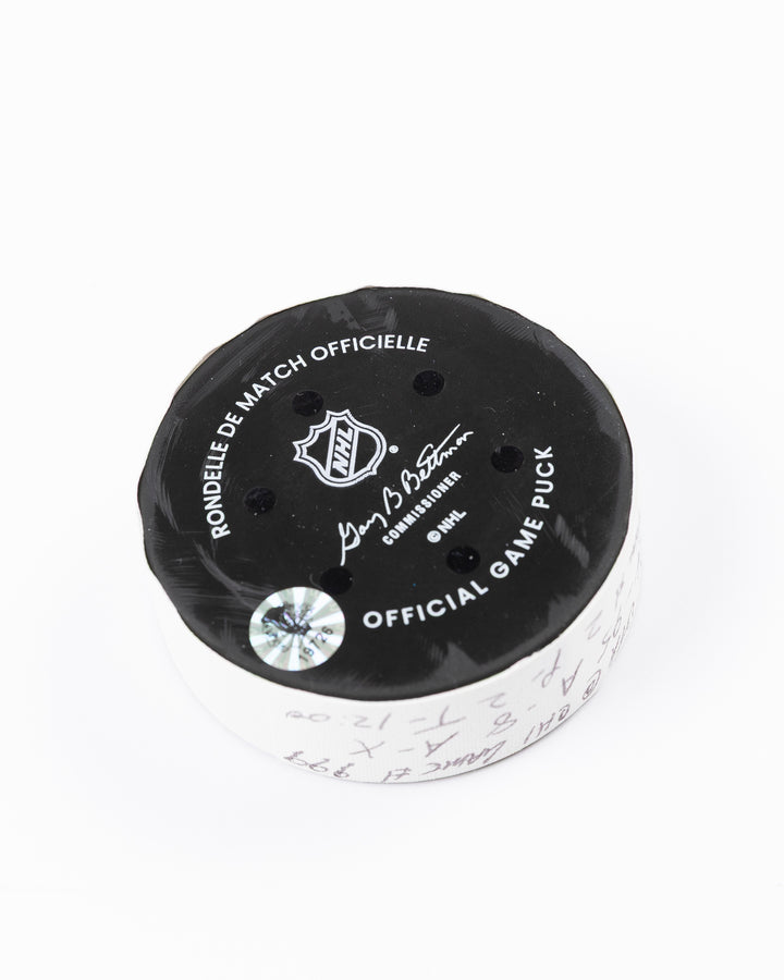 official game used hockey goal puck scored by Chicago Blackhawks player Ilya Mikheyev - back angle lay flat