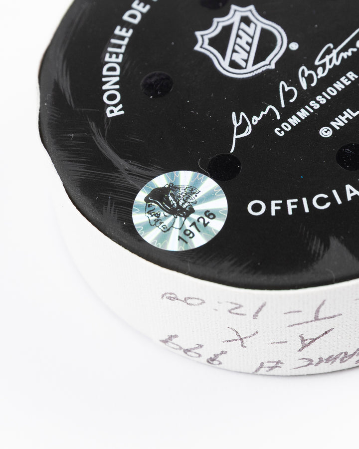 official game used hockey goal puck scored by Chicago Blackhawks player Ilya Mikheyev - hologram sticker detail lay flat