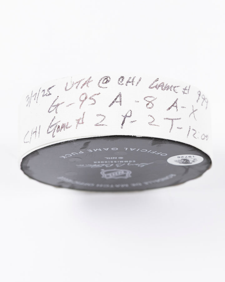 official game used hockey goal puck scored by Chicago Blackhawks player Ilya Mikheyev - tape detail lay flat