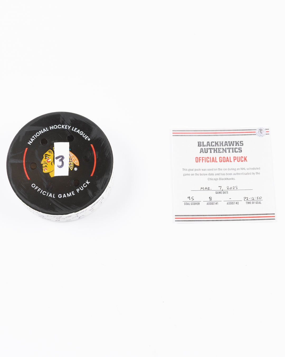official game used hockey goal puck scored by Chicago Blackhawks player Ilya Mikheyev - front lay flat puck and certificate