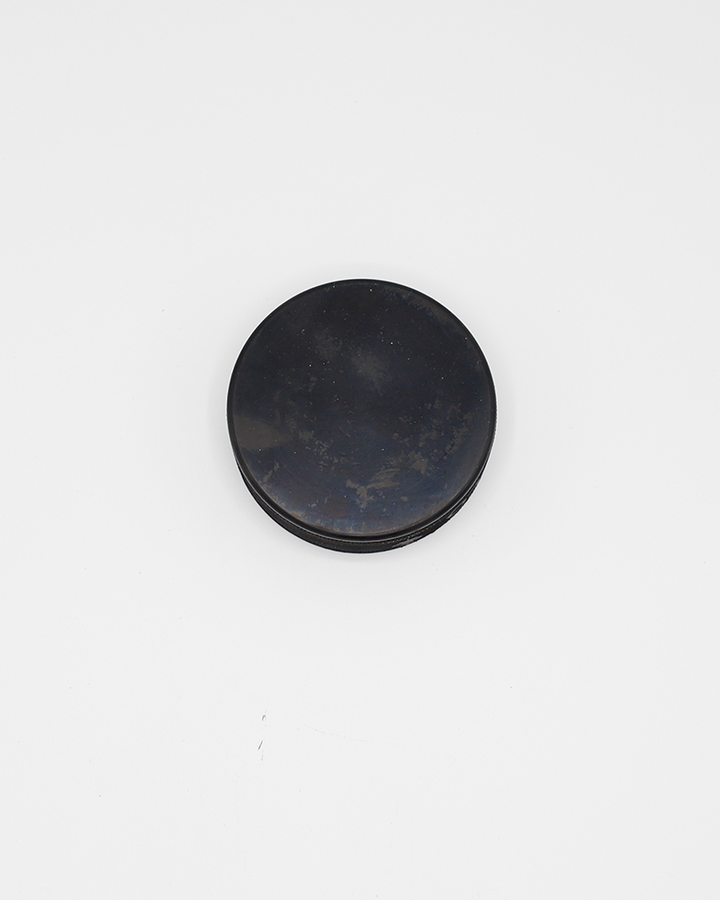 black hockey puck with Rockford IceHogs Hammy underneath a Bickell 44 graphic - back lay flat