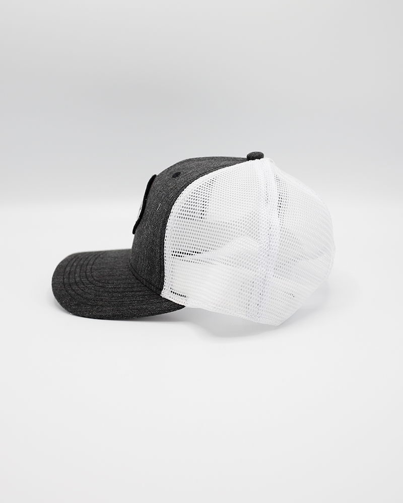 black and white Legacy trucker hat with 1999 IceHogs Hockey patch on front - left side lay flat
