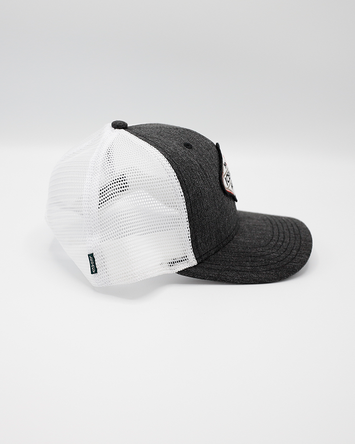 black and white Legacy trucker hat with 1999 IceHogs Hockey patch on front - right side lay flat