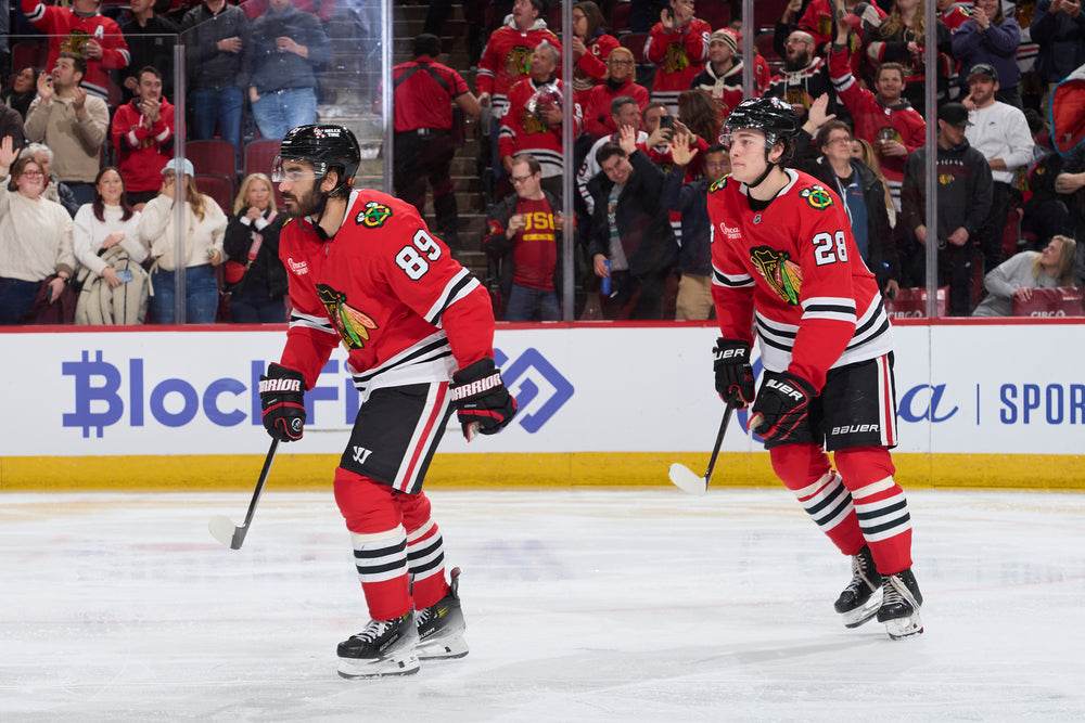 Chicago Blackhawks players Andreas Athanasiou and Colby Dach after Athansiou scored against LA Kings