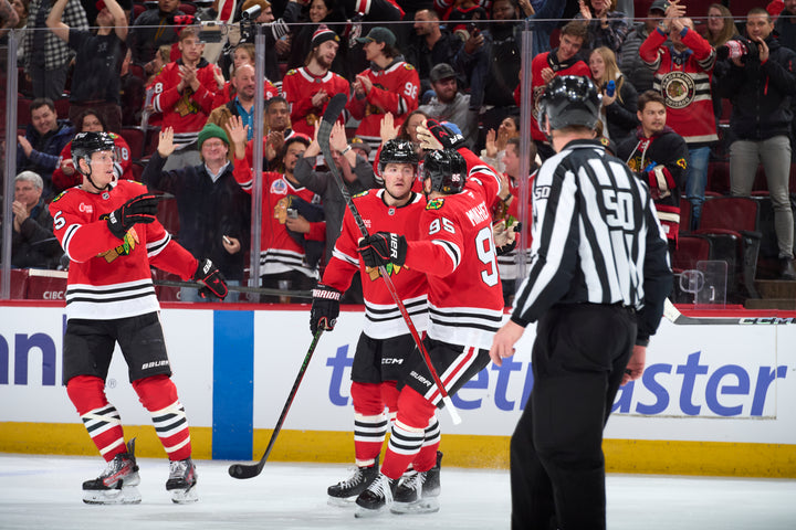 Chicago Blackhawks players Murphy Mikheyev and Donato celebrating Donato goal against LA Kings