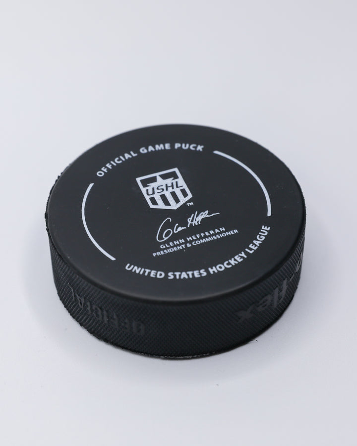 official game hockey puck of the Chicago Steel - angled back lay flat