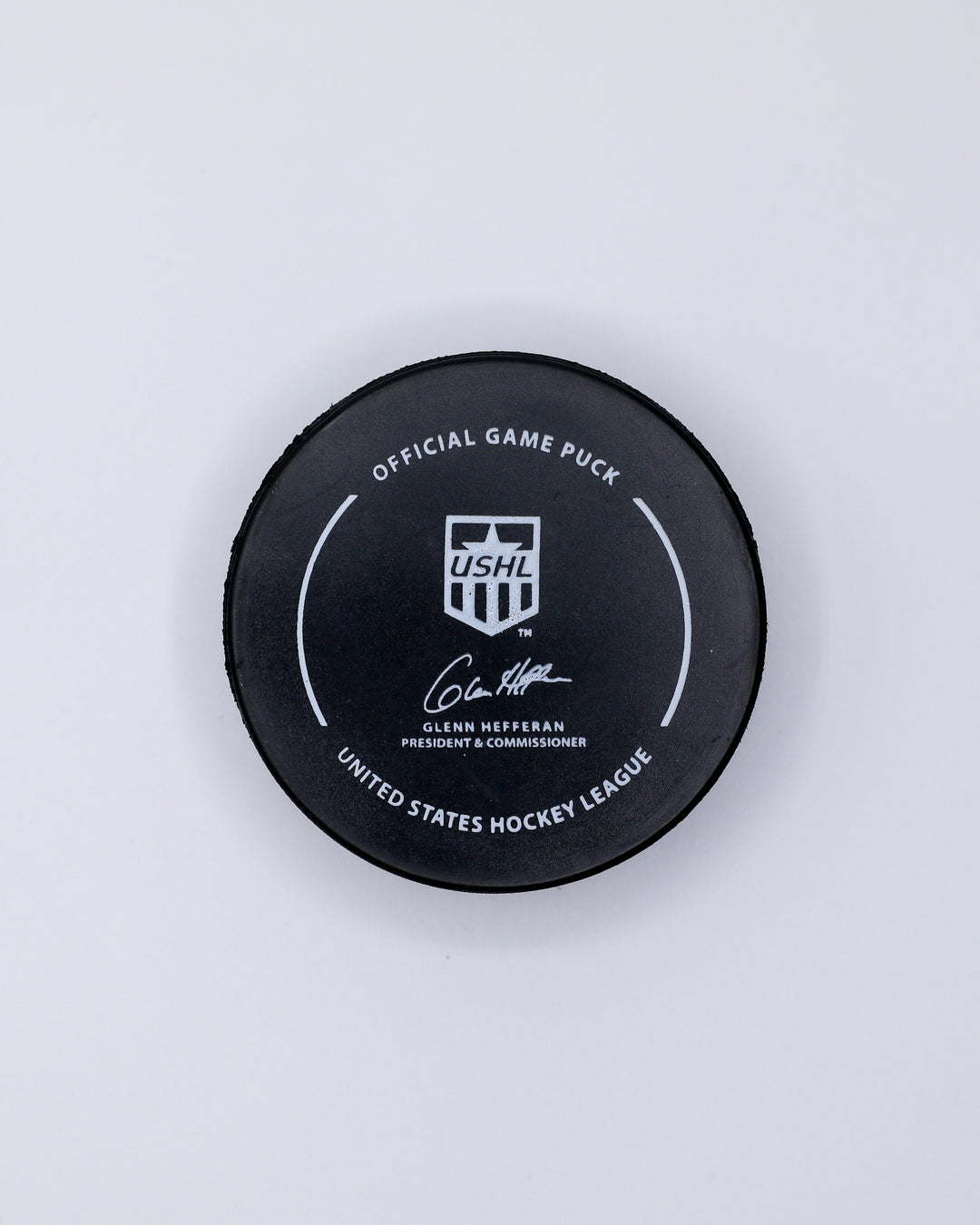 official game hockey puck of the Chicago Steel - back lay flat