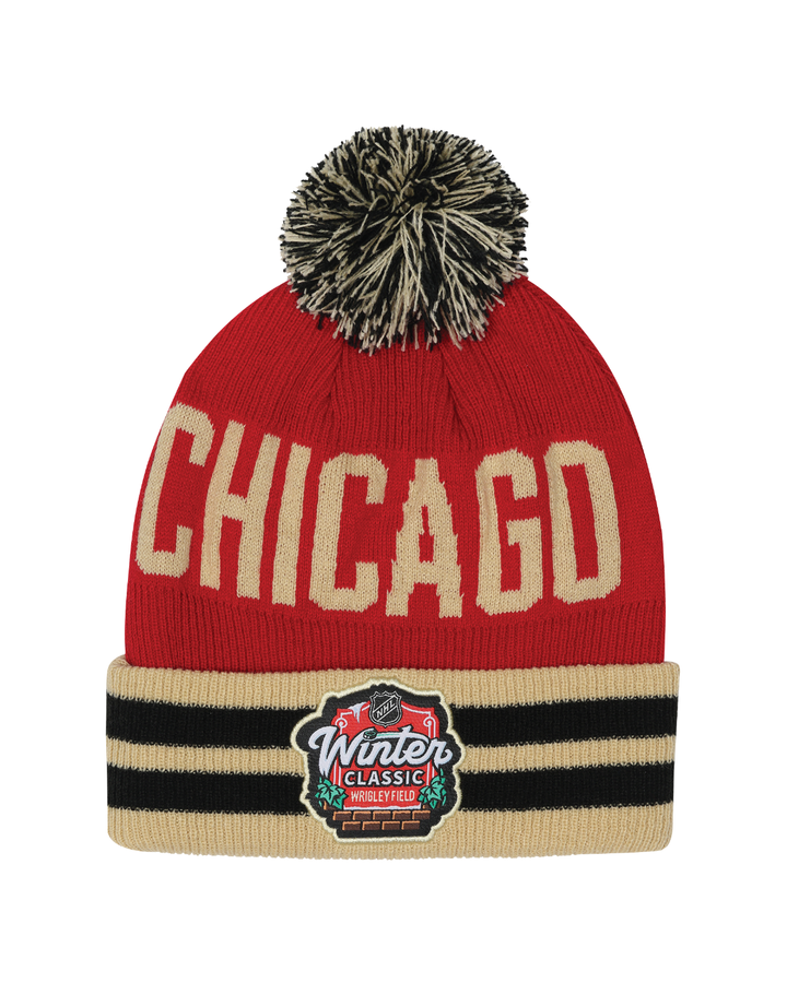 red youth knit hat with multicolor pom and Chicago wordmark on front and Chicago Blackhawks Winter Classic logo on front cuff - back lay flat