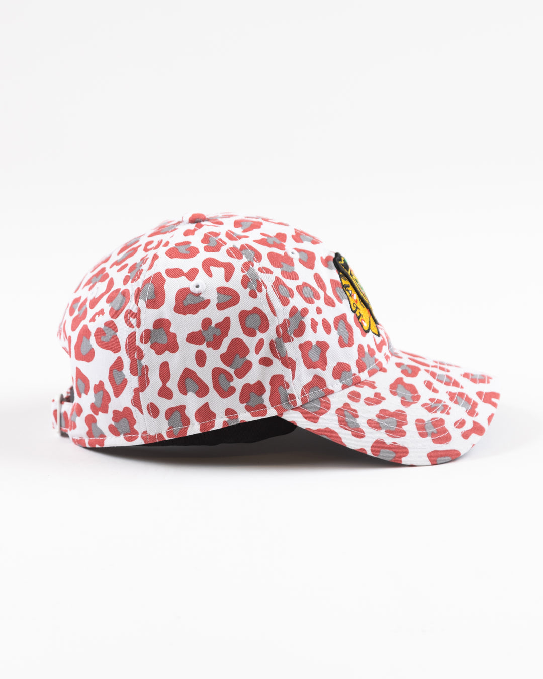 white New Era women's cap with all over pink cheetah print and Chicago Blackhawks primary logo on front - right side lay flat