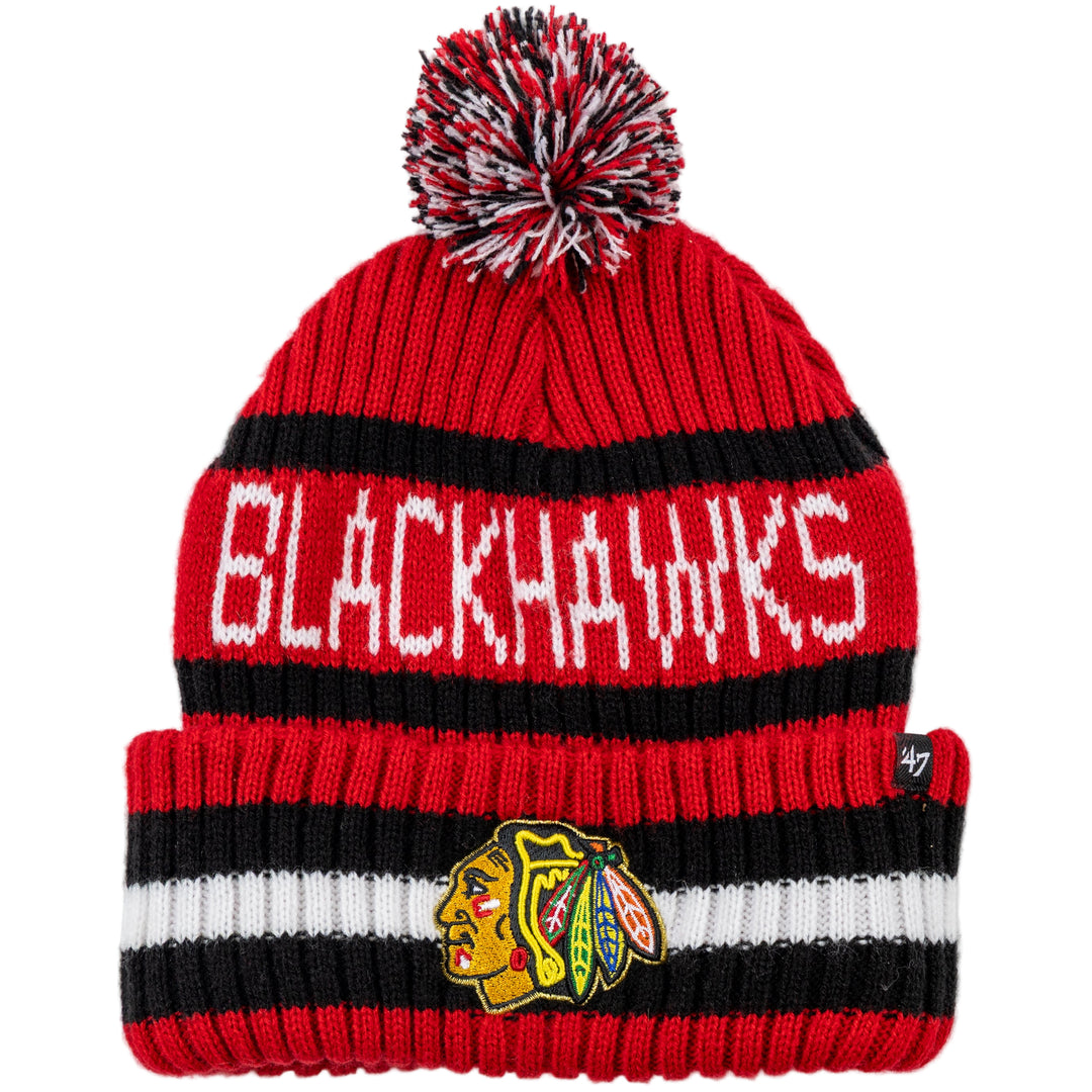 Red and black knit beanie with pom-pom and Blackhawks logo on a white background
