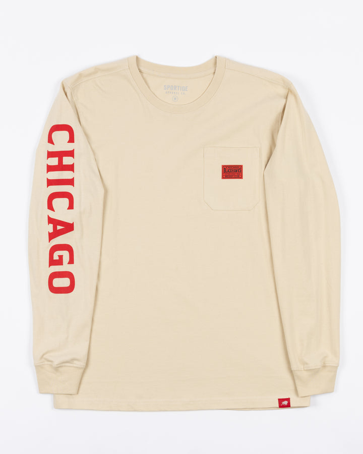 cream long sleeve pocket tee from Sportiqe with Chicago wordmark down right sleeve and Blackhawks tag on left chest pocket - front lay flat