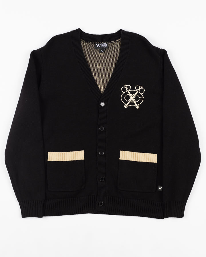 black Wild Collective button down cardigan with Chicago Blackhawks secondary logo on left chest and primary logo in Chicago skyline design on back - front lay flat