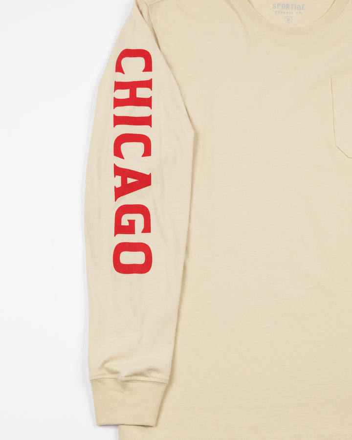 cream long sleeve pocket tee from Sportiqe with Chicago wordmark down right sleeve and Blackhawks tag on left chest pocket - sleeve detail lay flat