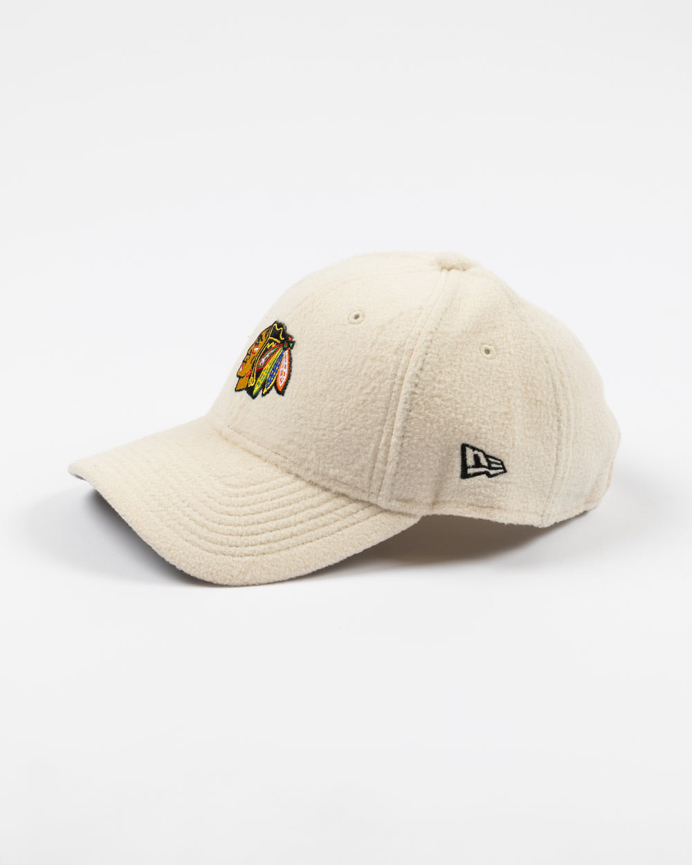 white sherpa New Era adjustable cap with Chicago Blackhawks primary logo embroidered on front - left side lay flat