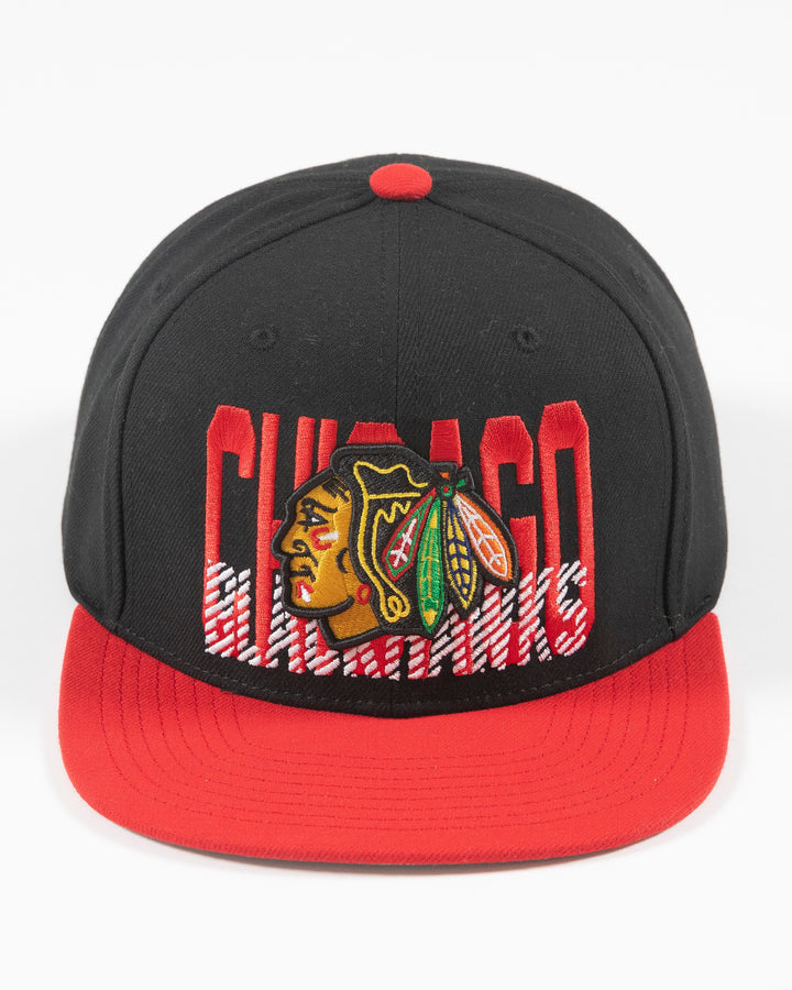 Mitchell & Ness Chicago Blackhawks snapback with red brim and primary logo with cross check wordmark embroidered on front panel - front lay flat