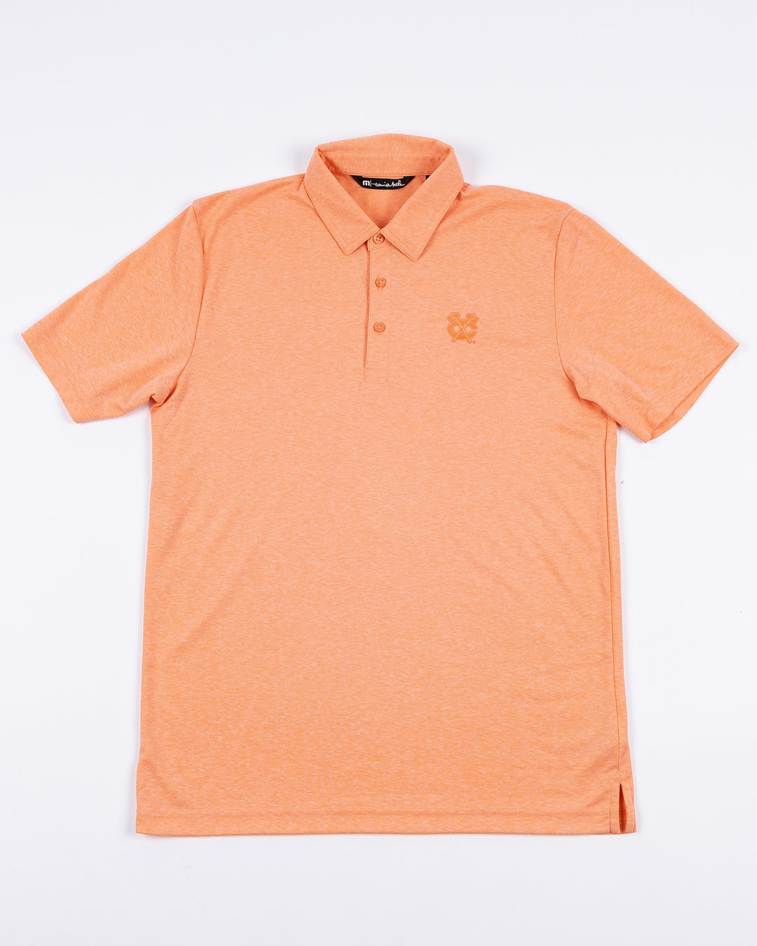 orange TravisMathew polo with Chicago Blackhawks secondary logo embroidered on left chest - front lay flat