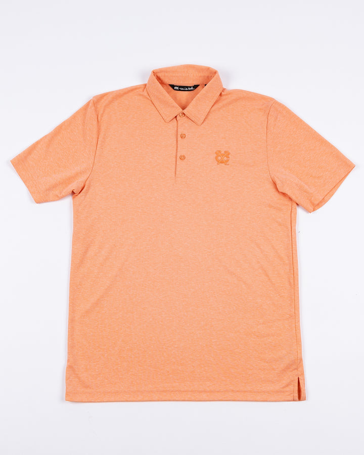 orange TravisMathew polo with Chicago Blackhawks secondary logo embroidered on left chest - front lay flat