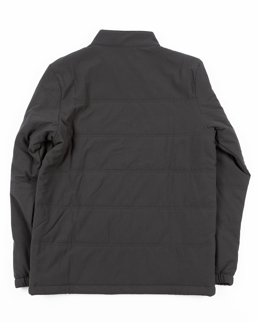 black TravisMathew quilted puffer full zip jacket with Chicago Blackhawks primary logo embroidered on left shoulder - back lay flat