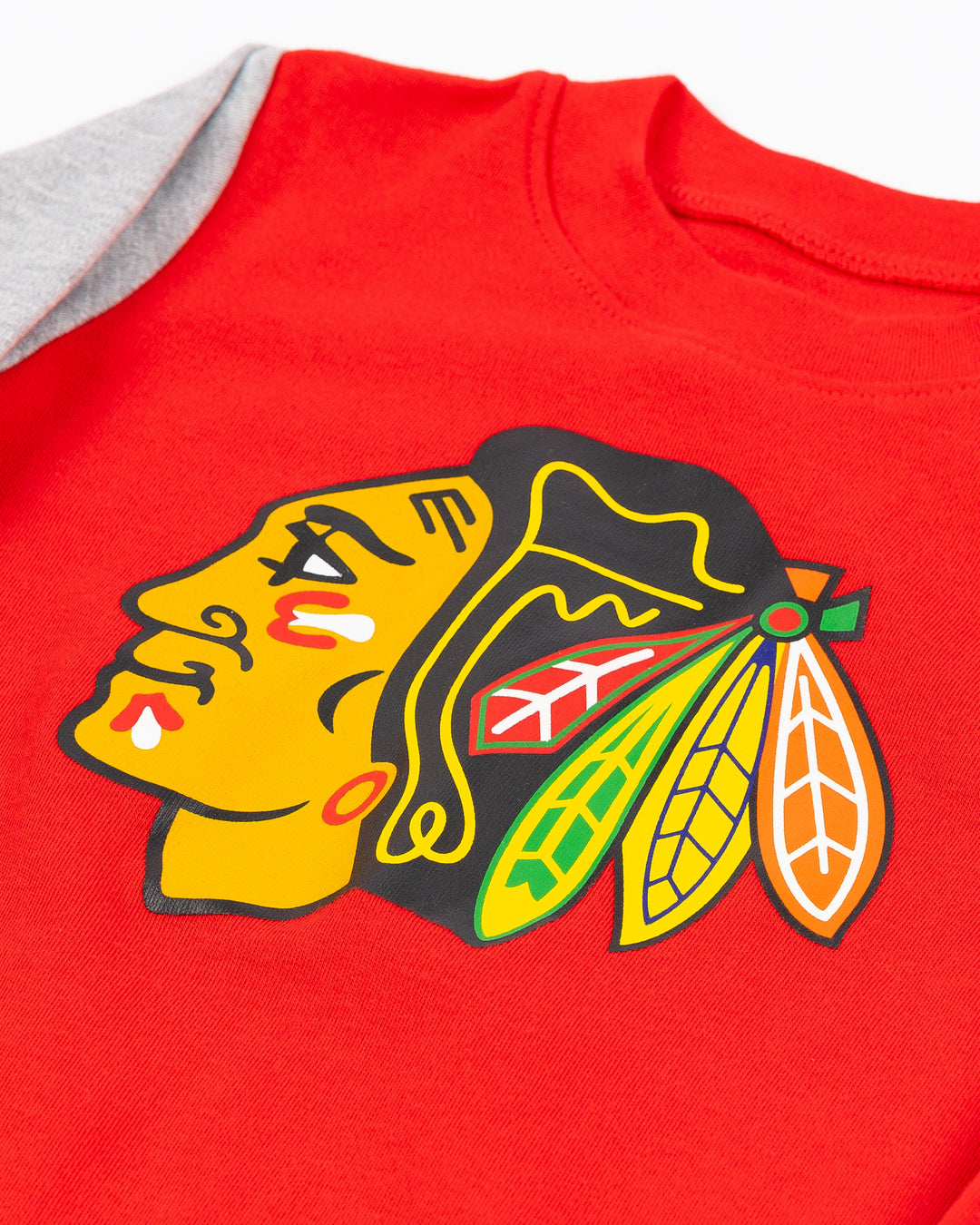 color blocked infant onesie with Chicago Blackhawks primary logo printed on front with snap closure - detail lay flat