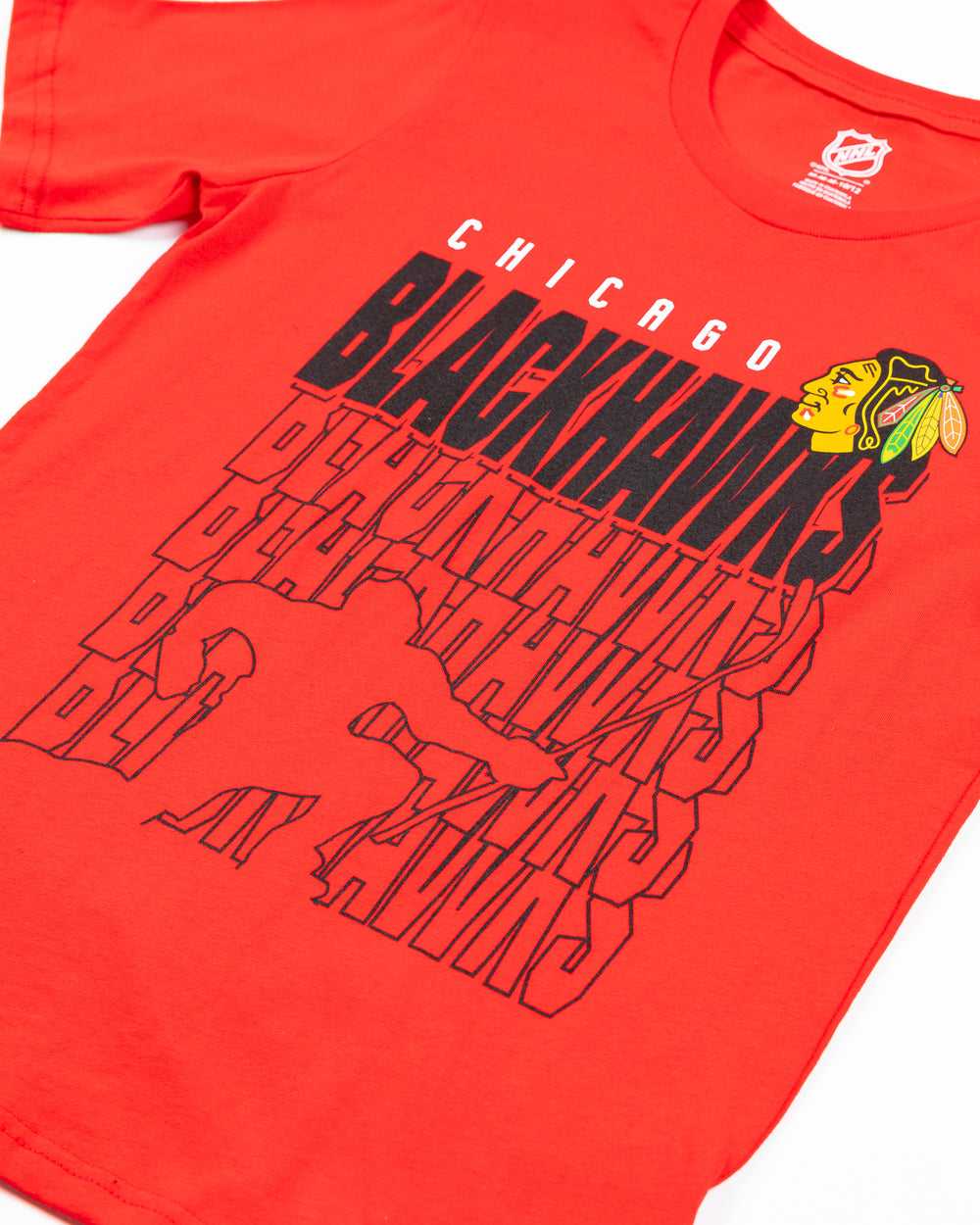 red youth tee with repeating Chicago Blackhawks wordmark and celly silhouette on front - detail lay flat