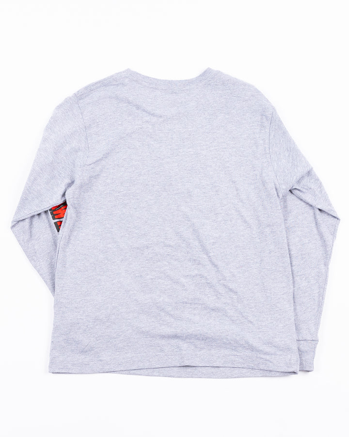 grey youth long sleeve tee with Chicago Blackhawks wodmark on left arm and primary logo hockey sick graphic across chest - back lay flat