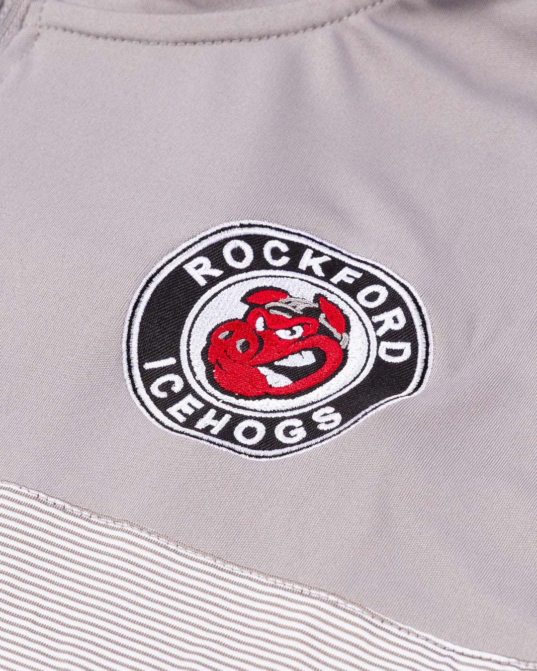 grey Colosseum quarter zip with embroidered Rockford IceHogs logo on left chest - detail lay flat