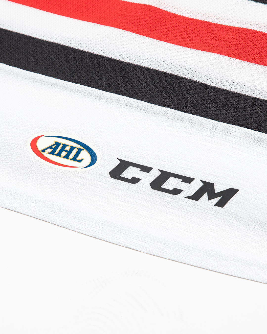 white CCM adult replica Rockford IceHogs jersey - detail logo lay flat