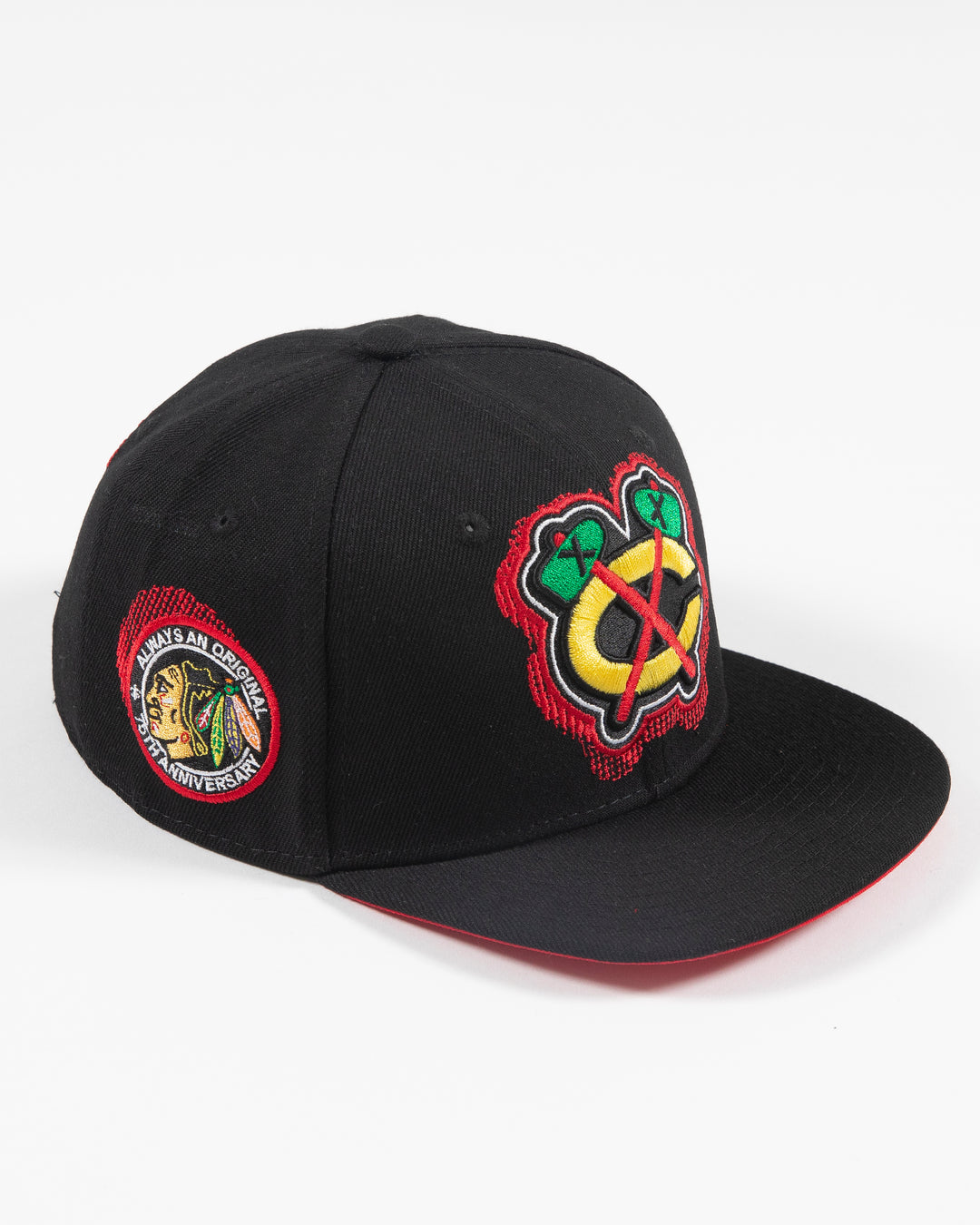 black Mitchell & Ness snapback with Chicago Blackhawks secondary logo embroidered on front and primary logo patch embroidered on right side - right angle lay flat 