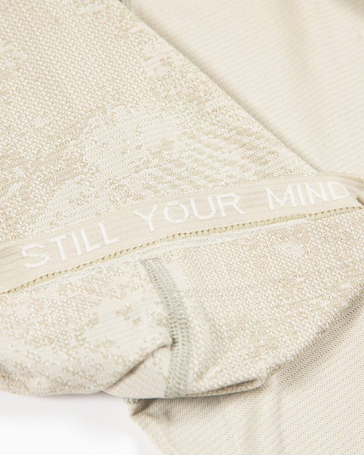 off white lululemon short sleeve t-shirt with Chicago Blackhawks secondary logo on left shoulder - detail lay flat