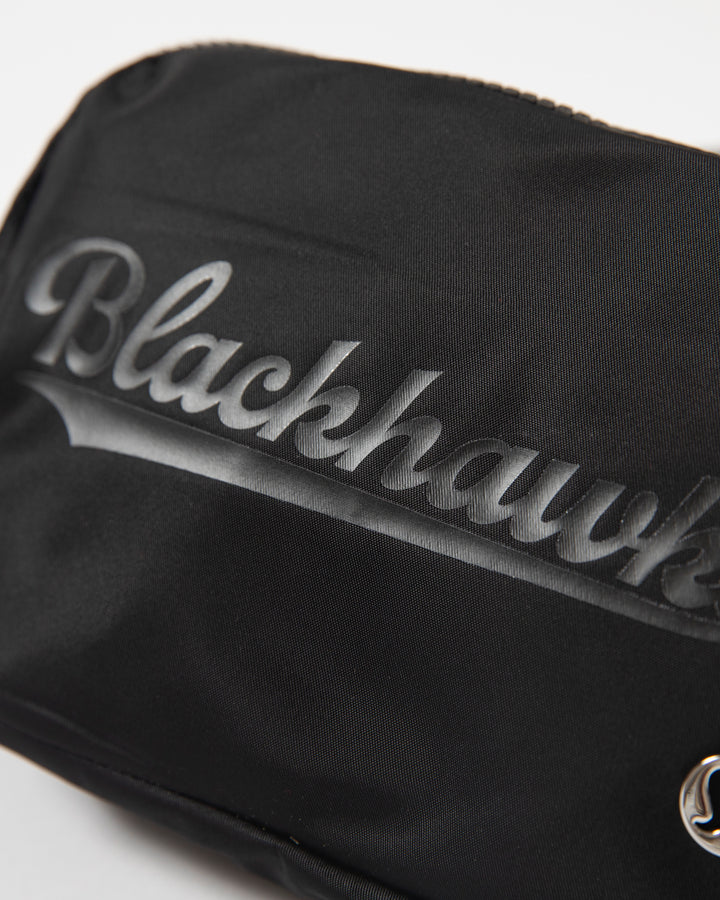 black lululemon Everywhere Belt Bag with Chicago Blackhawks wordmark graphic in black across front - detail lay flat