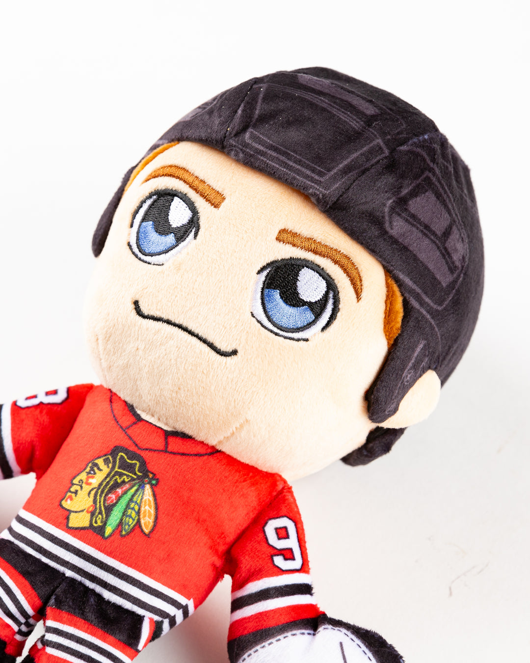 plush Connor Bedard with Chicago Blackhawks hockey uniform - detail lay flat