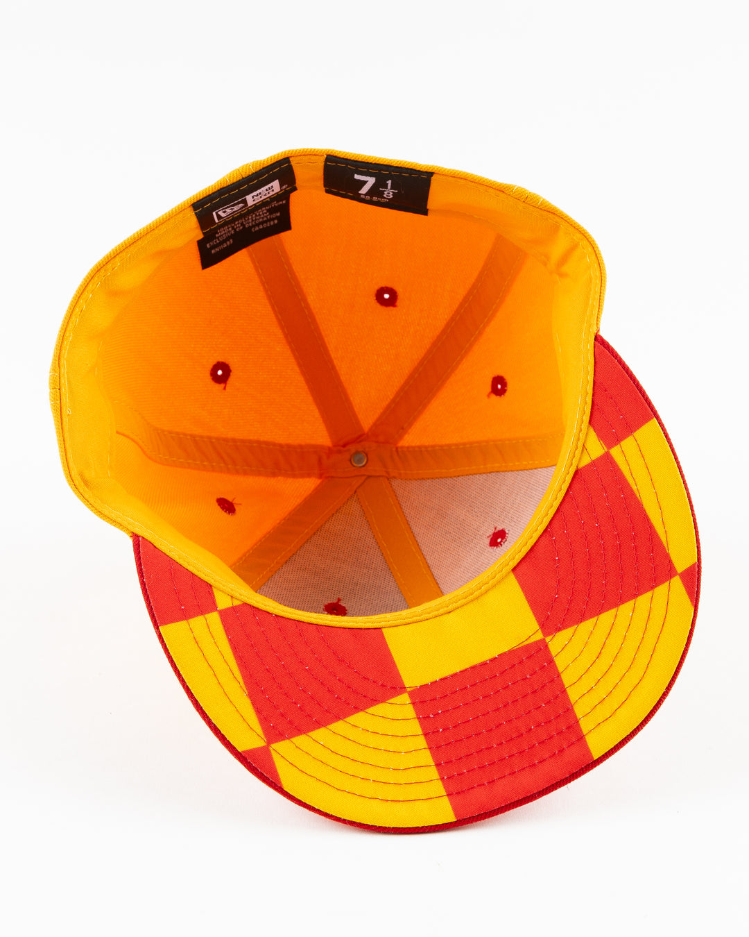 yellow and red New Era fitted cap with Chicago Blackhawks wordmark on front - under brim lay flat