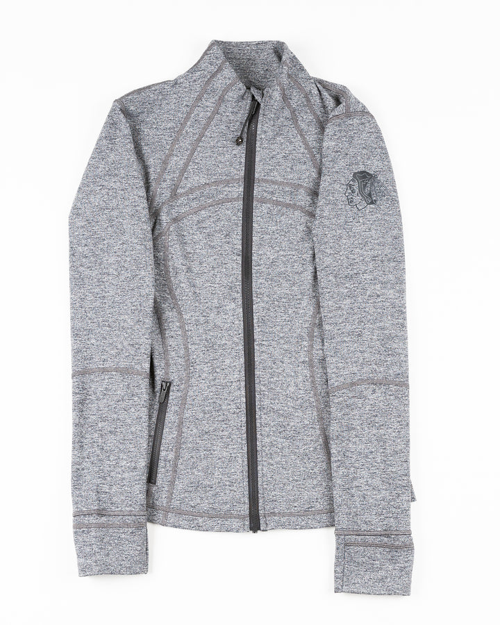 grey lululemon zip up women's jacket with tonal Chicago Blackhawks primary logo printed on left shoulder - front lay flat