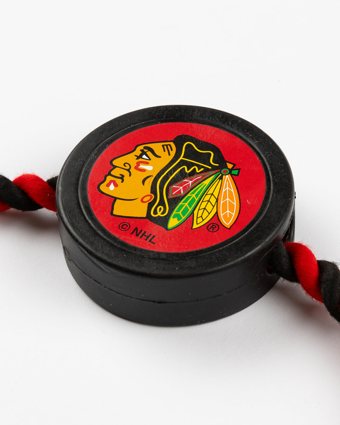 Chicago Blackhawks pet toy in shape of puck and rope - detail lay flat