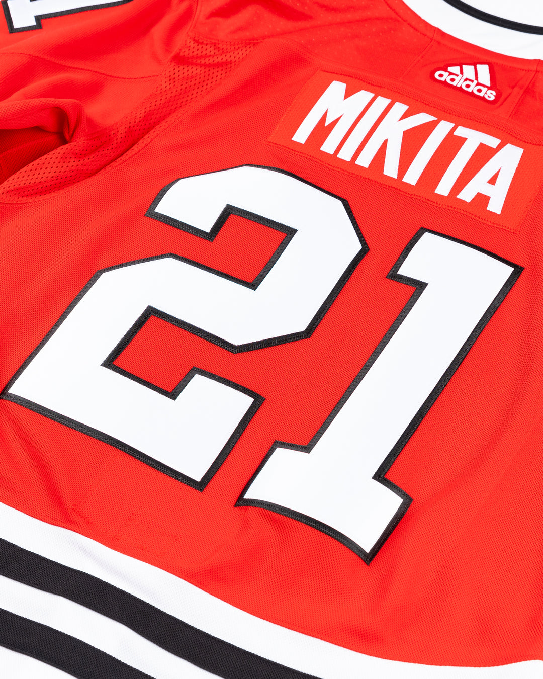 red adidas Chicago Blackhawks jersey with Stan Mikita name and number stitched - back detail lay flat