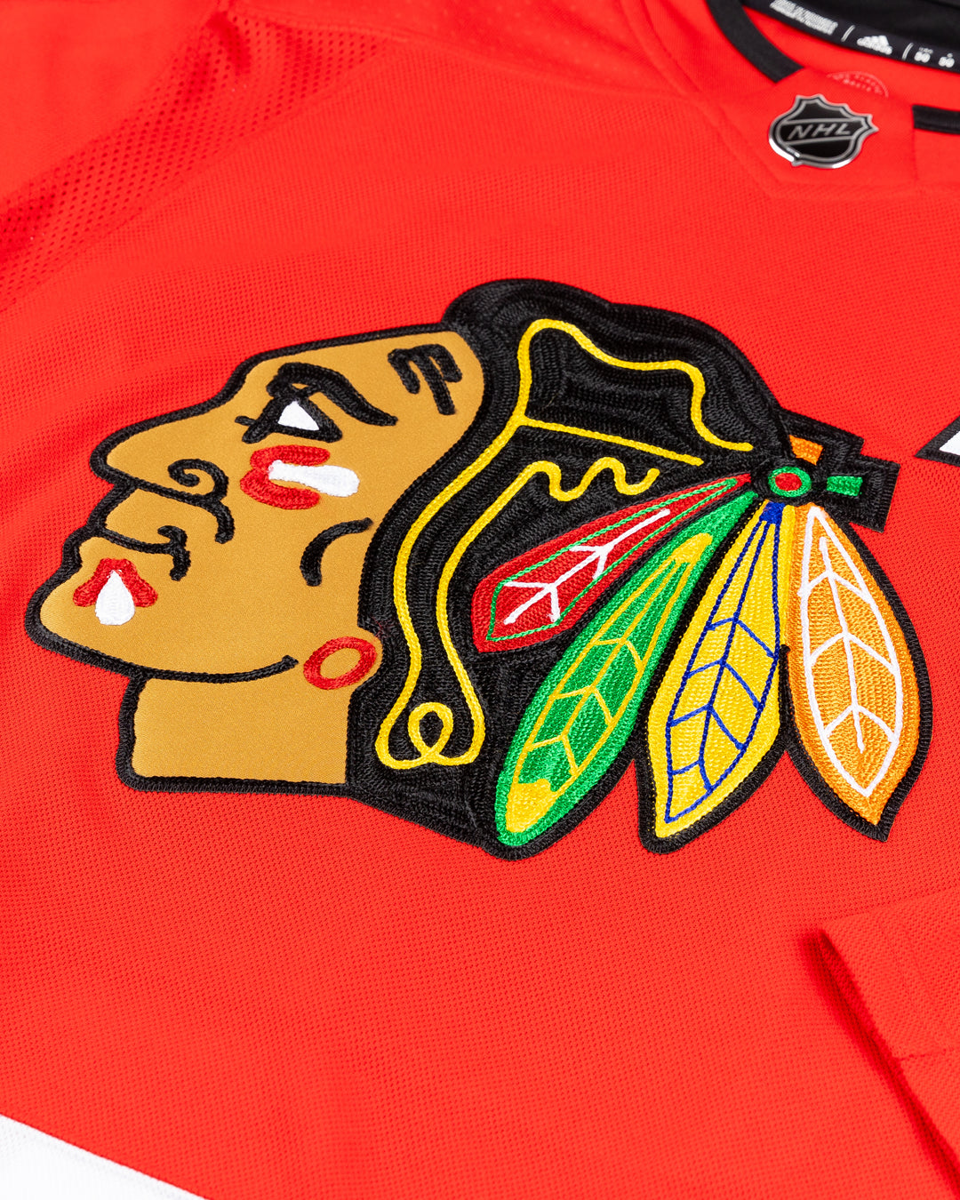 red adidas home Chicago Blackhawks jersey with pro stitched Nick Foligno name and number - front detail lay flat