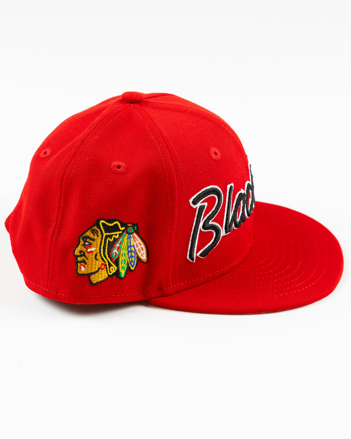 red youth New Era snapback cap with Chicago Blackhawks embroidered wordmark and primary logo on right side - right side lay flat