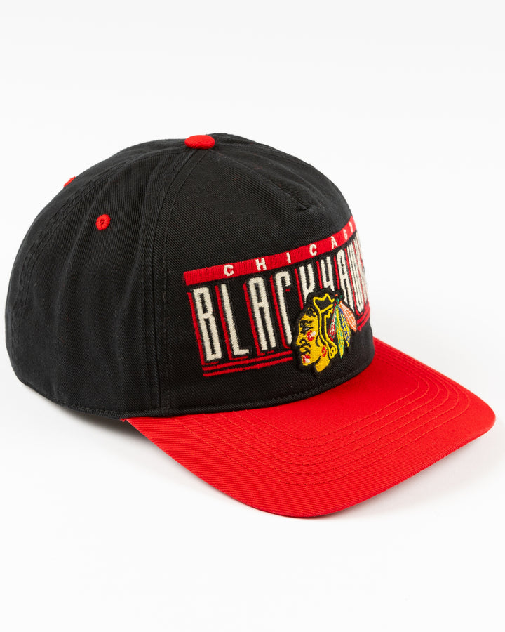 black and red '47 brand snapback hat with Chicago Blackhawks wordmark and primary logo embroidered on the front - right angle lay flat