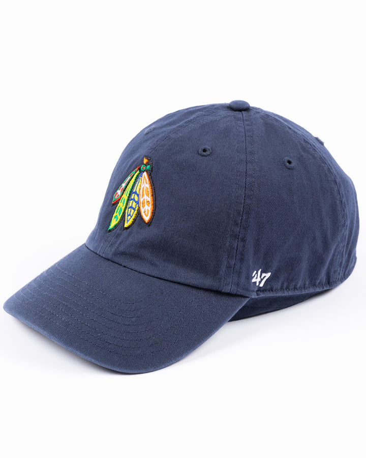 navy '47 brand adjustable hat with Chicago Blackhawks four feather logo embroidered on front and University of Michigan logo embroidered on right side - left angle lay flat