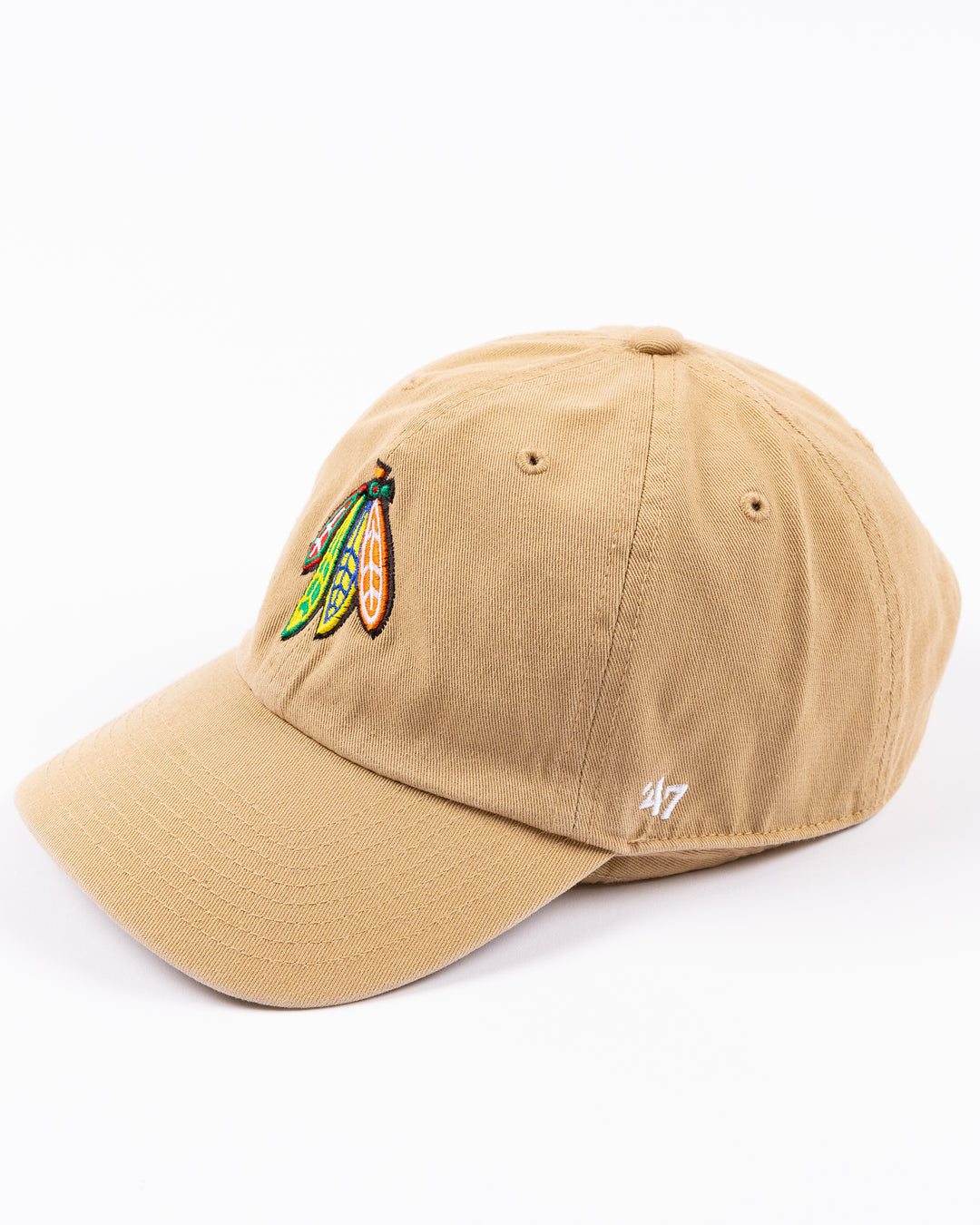 khaki '47 brand adjustable cap with Chicago Blackhawks four feathers logo embroidered on front and Purdue University logo embroidered on right side - left angle lay flat