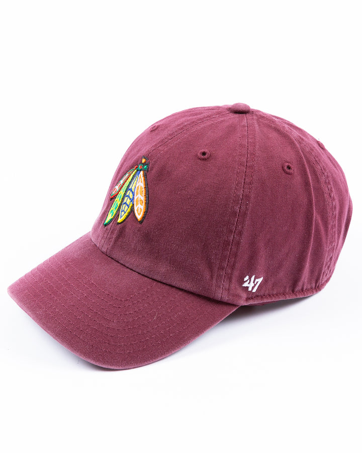 maroon '47 brand adjustable hat with Chicago Blackhawks four feathers logo embroidered on front and Loyola University Chicago logo embroidered on right side - left angle lay flat