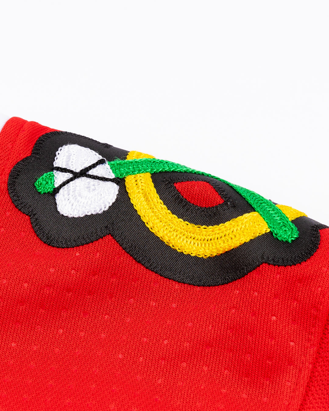 red adidas Chicago Blackhawks hockey jersey with stitched Frank Nazar name and number - alt shoulder detail lay flat