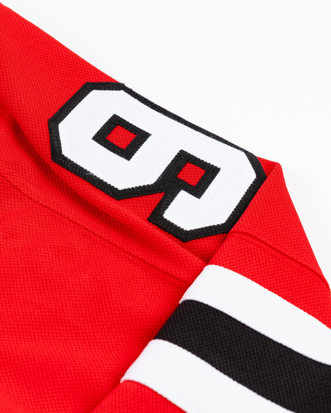 red adidas Chicago Blackhawks hockey jersey with stitched Frank Nazar name and number - shoulder detail lay flat